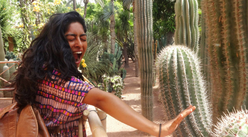 A volunteer in the cactus garden in the Majorelle gardens in Marrakesh.