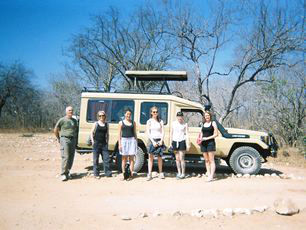 volunteers-about-to-go-on-tanzania-safari-standing-by-pop-up-top-vehicle