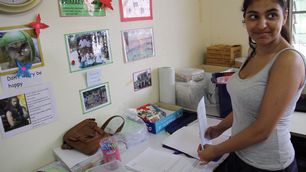 volunteer-picks-up-teaching-resources-from-programmes-head-office-in-Khao-Lak-thailand