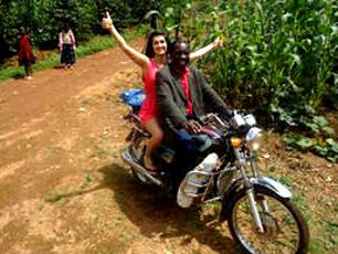 hannah-enjoying-the-bike-with-the-director-cameroon